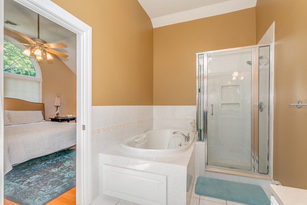 68 Chesterton Road Wellesley, MA 02481 - Photo 16 of 27 a bathroom with a tub and shower