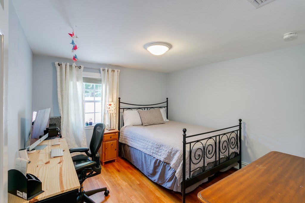 68 Chesterton Road Wellesley, MA 02481 - Photo 17 of 27 a bedroom with a bed and a window
