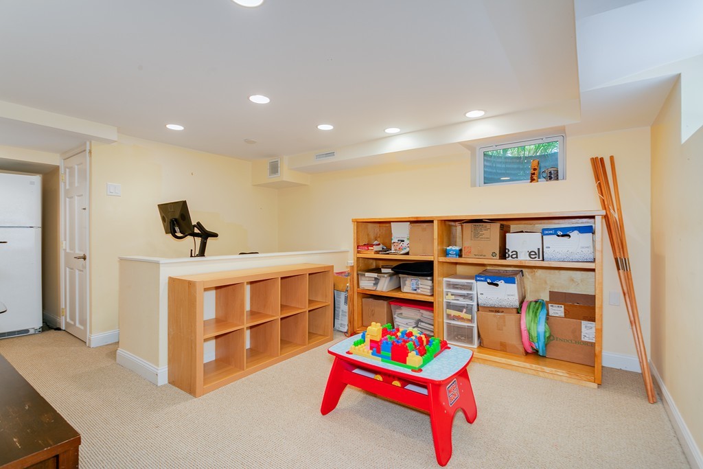 68 Chesterton Road Wellesley, MA 02481 - Photo 21 of 27 a bedroom with furniture and a flat screen tv