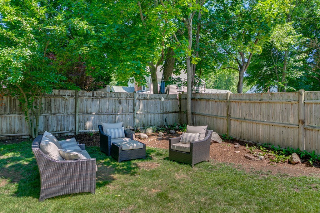 68 Chesterton Road Wellesley, MA 02481 - Photo 23 of 27 a backyard view with a garden and deck