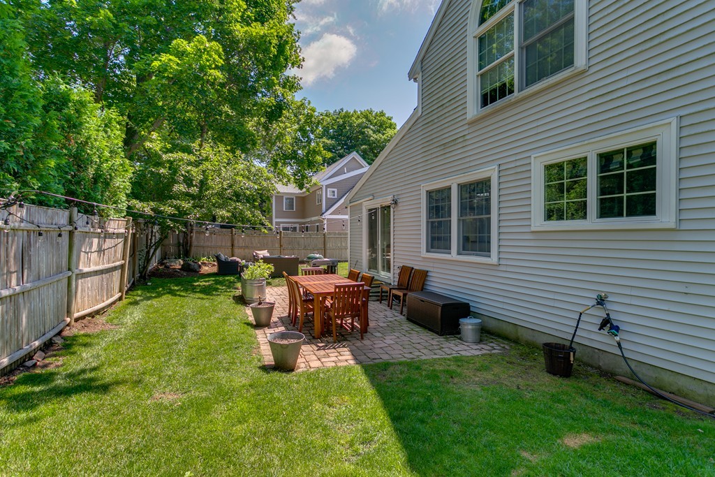 68 Chesterton Road Wellesley, MA 02481 - Photo 26 of 27 a view of backyard of house with a patio