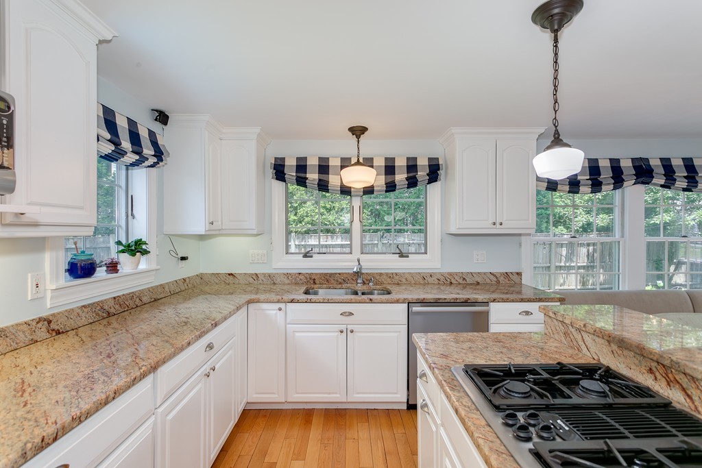 68 Chesterton Road Wellesley, MA 02481 - Photo 6 of 27 a kitchen with a sink stove and cabinets