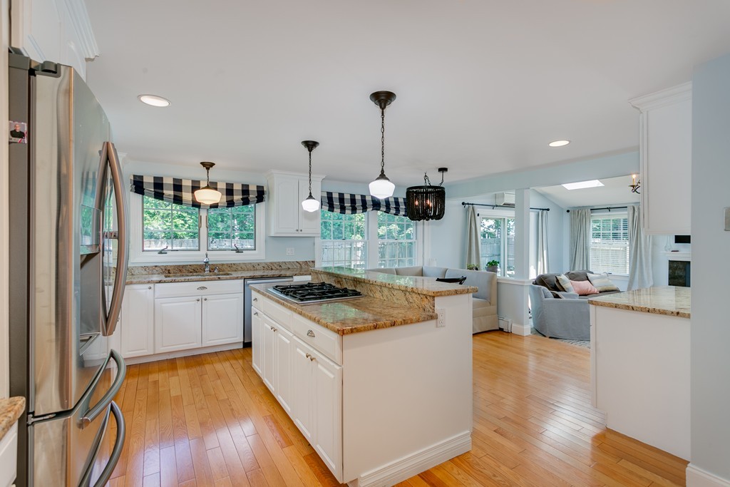 68 Chesterton Road Wellesley, MA 02481 - Photo 7 of 27 a kitchen with a stove a refrigerator and wooden floor