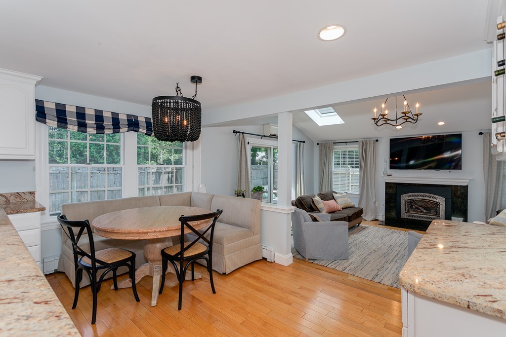 68 Chesterton Road Wellesley, MA 02481 - Photo 9 of 27 a living room with furniture a fireplace and a flat screen tv