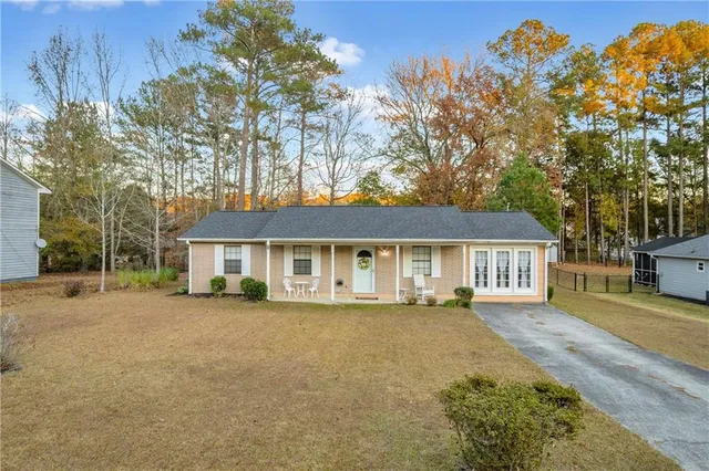 front view of a house with a bench