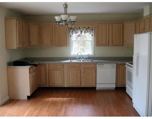 24 Baker Road Salisbury, MA 01952 - Photo 5 of 8 a kitchen with a sink window and cabinets