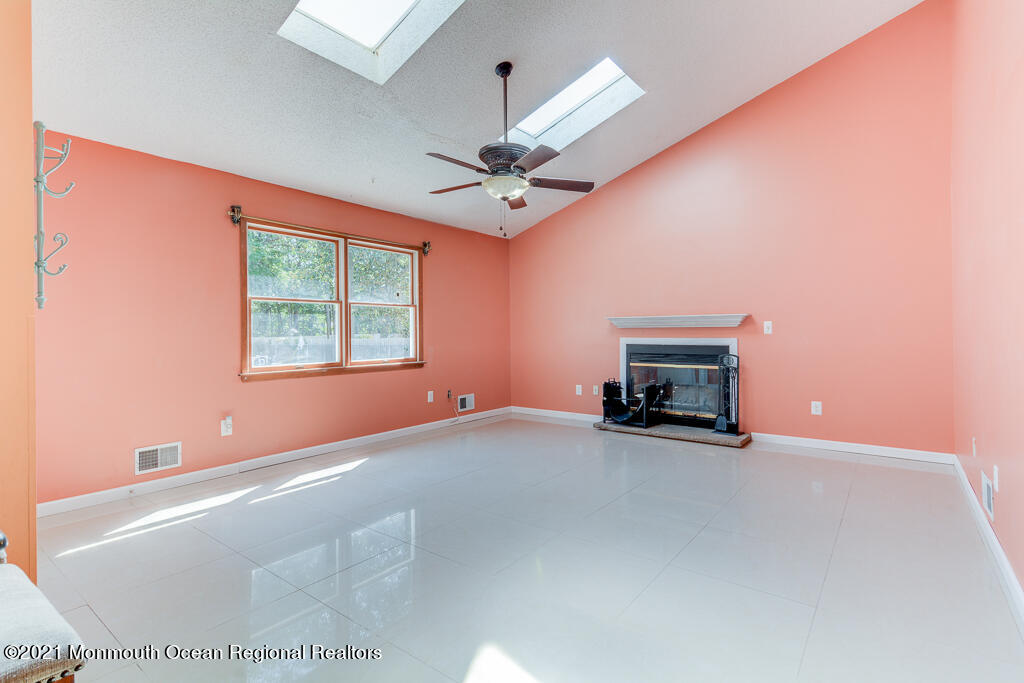 313 Emberly Road Brick, NJ 08723 - Photo 13 of 32 a view of an empty room with a fireplace