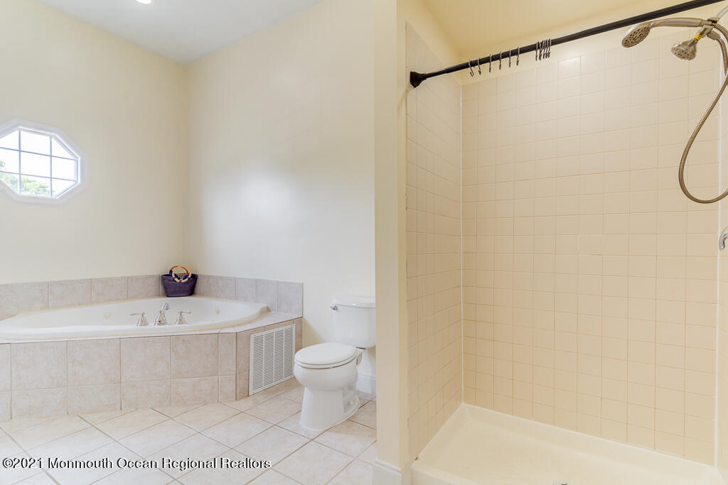 313 Emberly Road Brick, NJ 08723 - Photo 20 of 32 a bathroom with a sink a toilet and shower