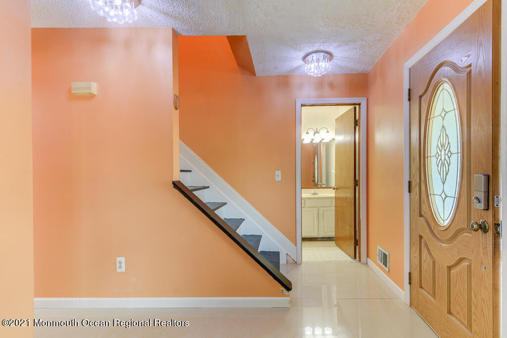 313 Emberly Road Brick, NJ 08723 - Photo 2 of 32 a view of a hallway with painted walls