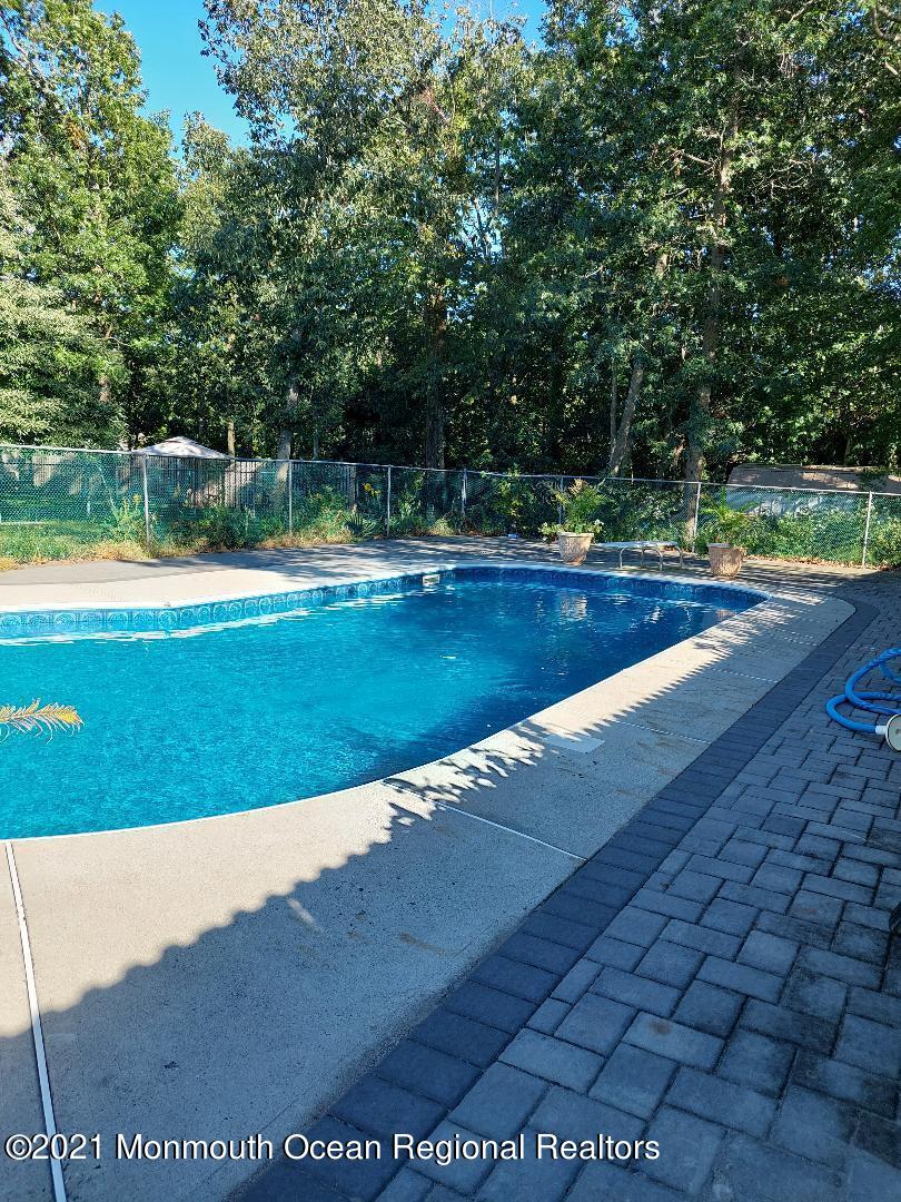 313 Emberly Road Brick, NJ 08723 - Photo 31 of 32 a view of a swimming pool with a yard