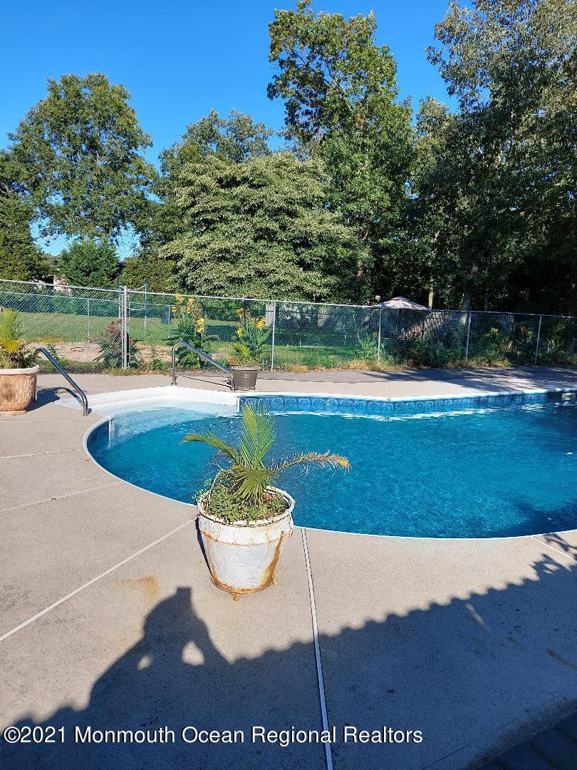 313 Emberly Road Brick, NJ 08723 - Photo 32 of 32 a view of a swimming pool with a yard