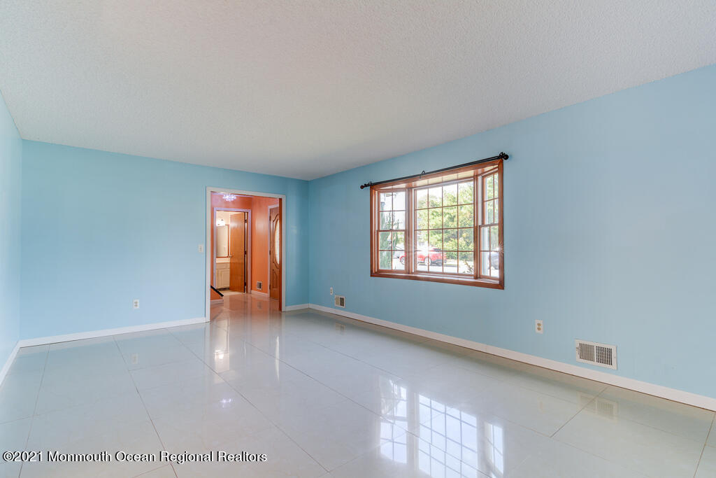 313 Emberly Road Brick, NJ 08723 - Photo 4 of 32 a view of an empty room with a window