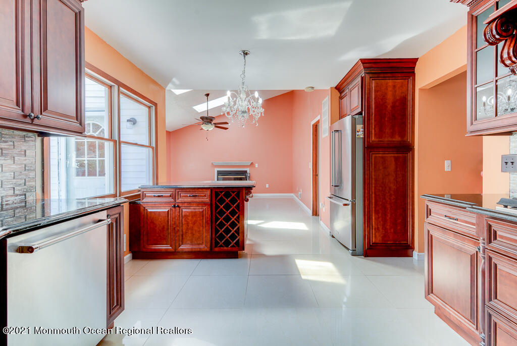 313 Emberly Road Brick, NJ 08723 - Photo 9 of 32 a view of living room kitchen and entryway
