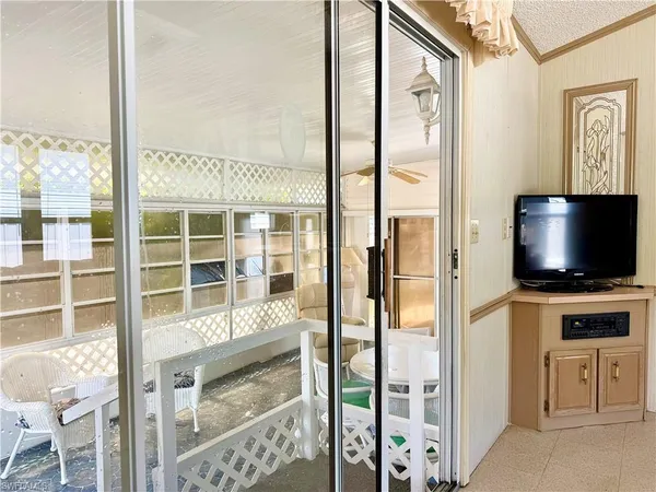 a view of a livingroom with furniture and a flat screen tv