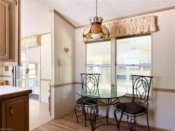 a view of a dining room with furniture window and outside view