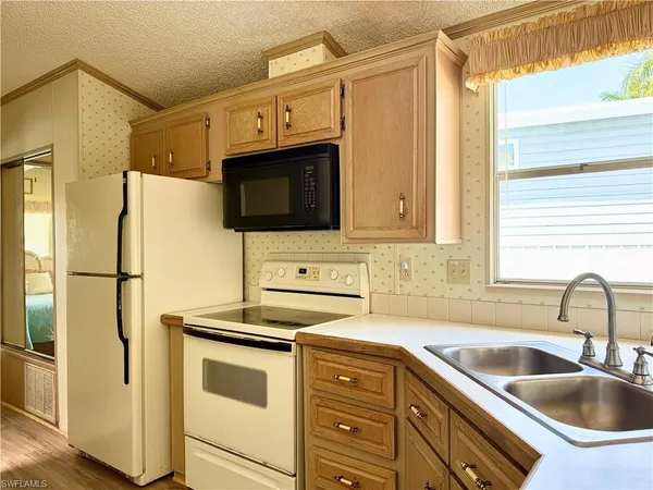 a bathroom with a sink and a window