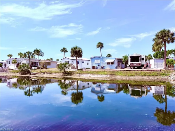 a view of a house with backyard water tub and couches