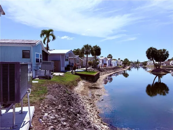 a backyard of a house with a garden and plants