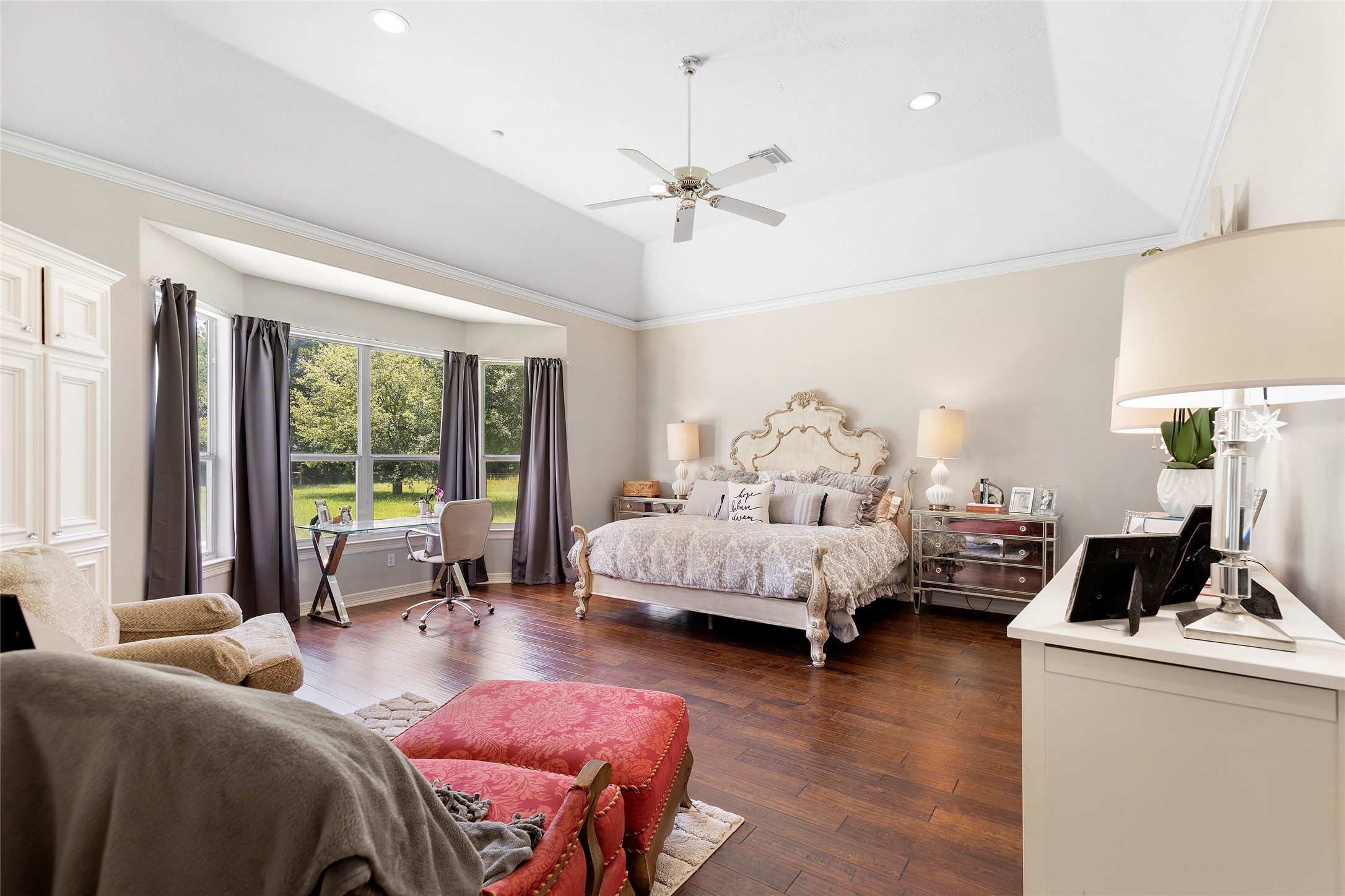 6530 Treaschwig Road, Unit 1 Spring, TX 77373 - Photo 18 of 32 a bedroom with a bed and a couch
