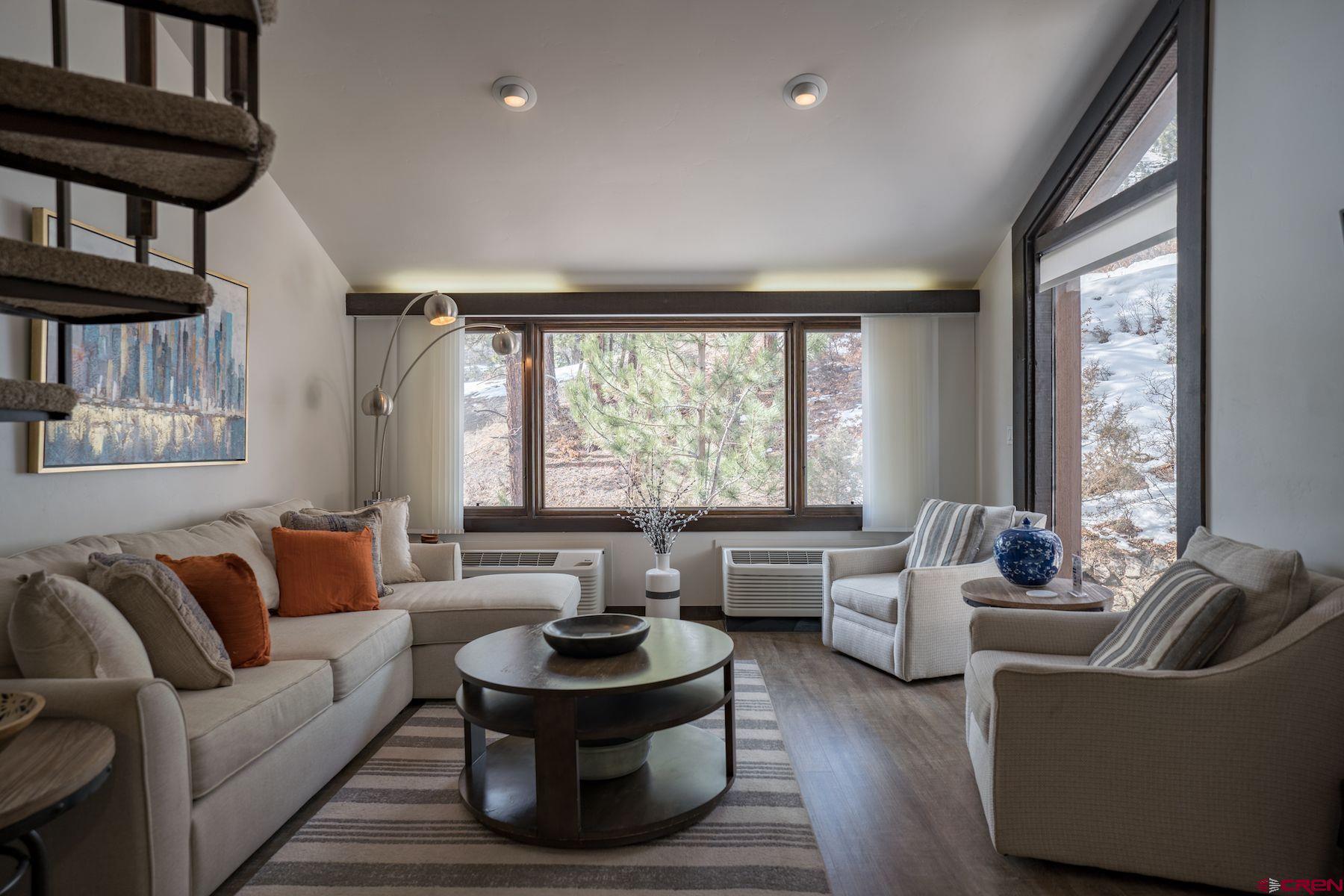 314 Tamarron Drive, Unit 342 Durango, CO 81301 - Photo 1 of 17 a living room with furniture and a large window