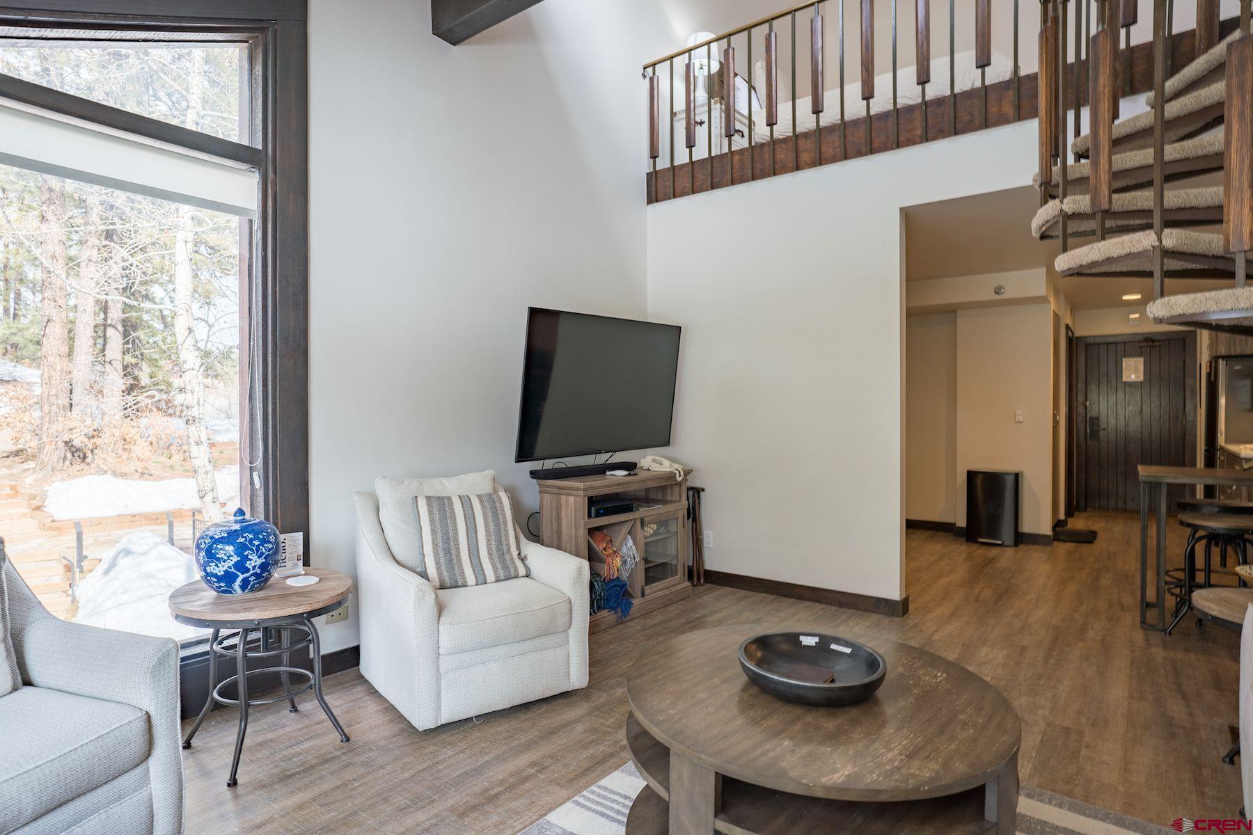 314 Tamarron Drive, Unit 342 Durango, CO 81301 - Photo 11 of 17 a living room with furniture and a flat screen tv