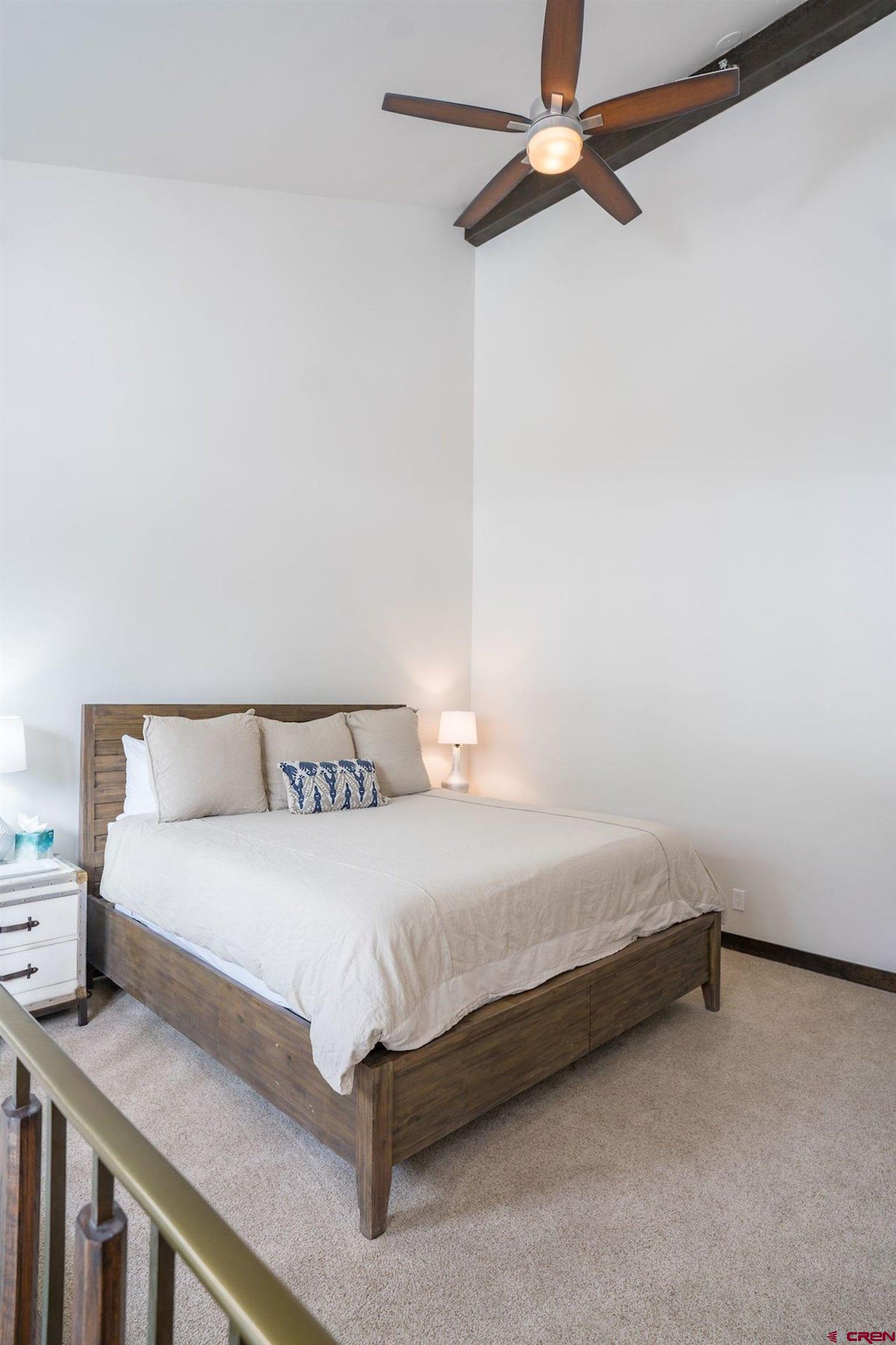 314 Tamarron Drive, Unit 342 Durango, CO 81301 - Photo 17 of 17 a bedroom with a bed and a table