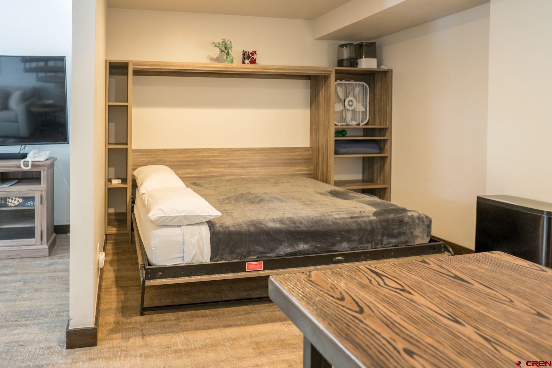 314 Tamarron Drive, Unit 342 Durango, CO 81301 - Photo 6 of 17 a bedroom with a bed and large mirror