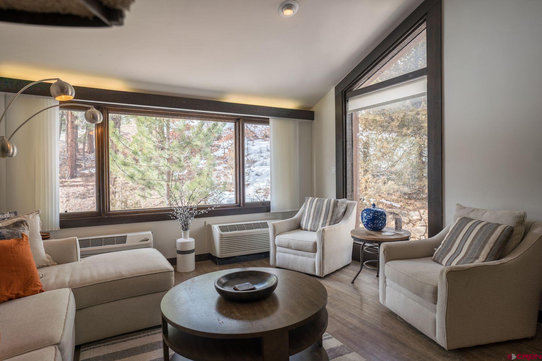 314 Tamarron Drive, Unit 342 Durango, CO 81301 - Photo 7 of 17 a living room with furniture and a large window