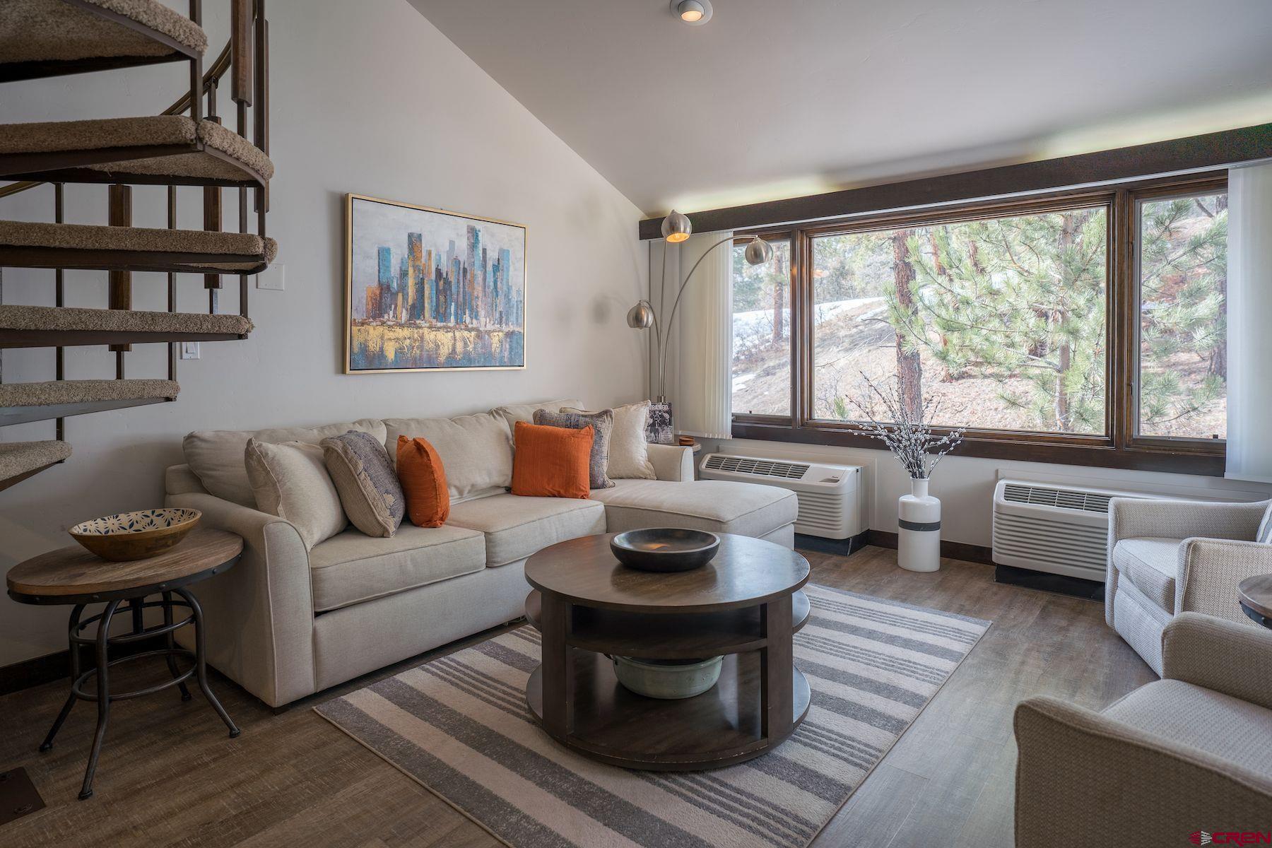314 Tamarron Drive, Unit 342 Durango, CO 81301 - Photo 8 of 17 a living room with furniture and a large window