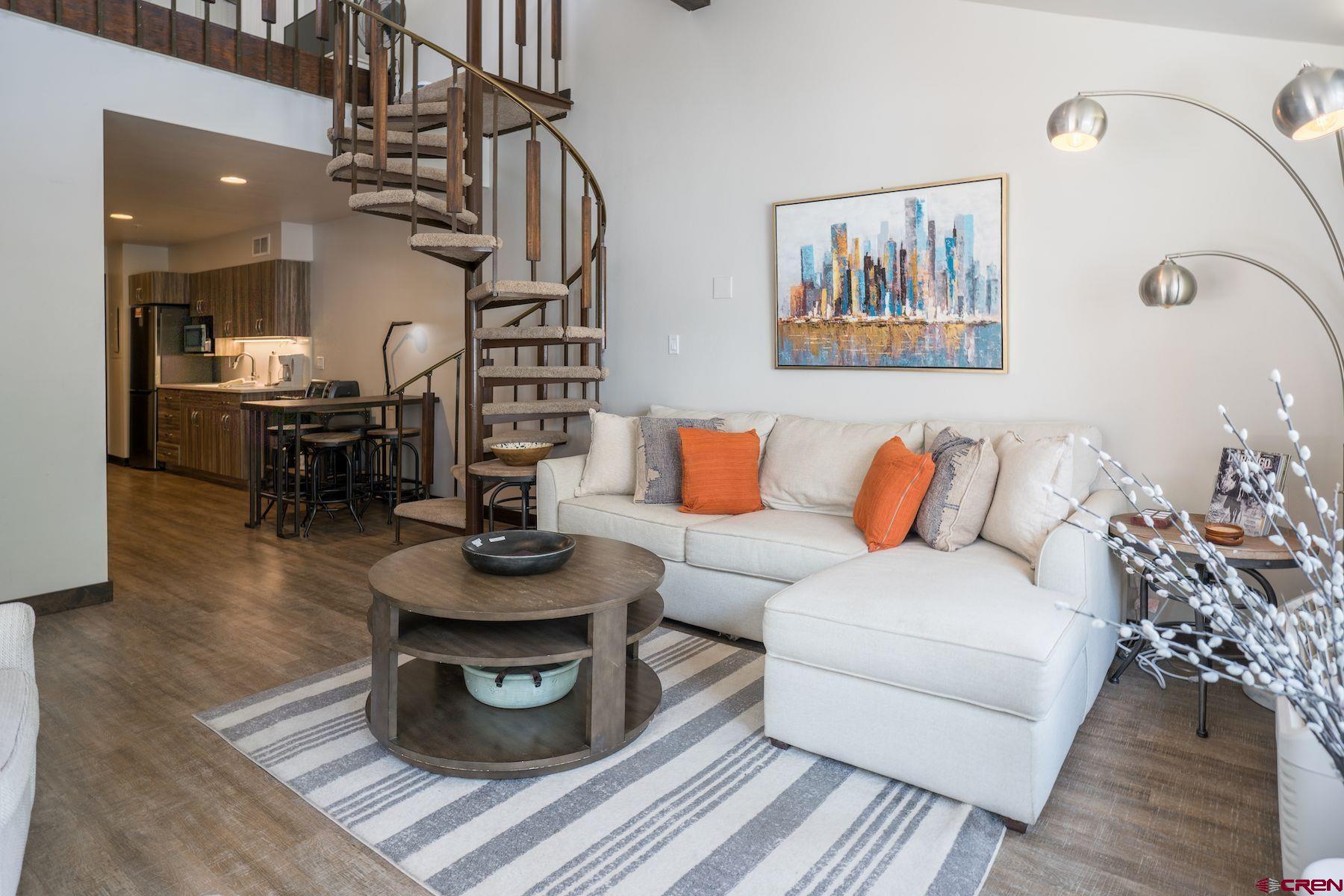 314 Tamarron Drive, Unit 342 Durango, CO 81301 - Photo 9 of 17 a living room with furniture and a wooden floor