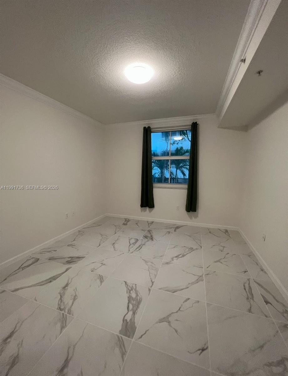 9172 Collins Avenue, Unit 214 Surfside, FL 33154 - Photo 15 of 33 a view of a livingroom with wooden floor and windows
