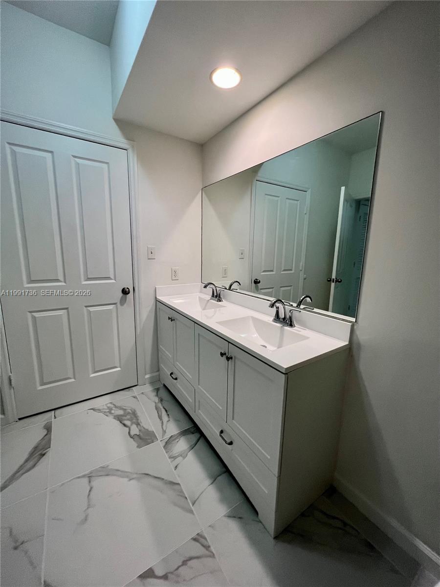 9172 Collins Avenue, Unit 214 Surfside, FL 33154 - Photo 21 of 33 a utility room with a sink