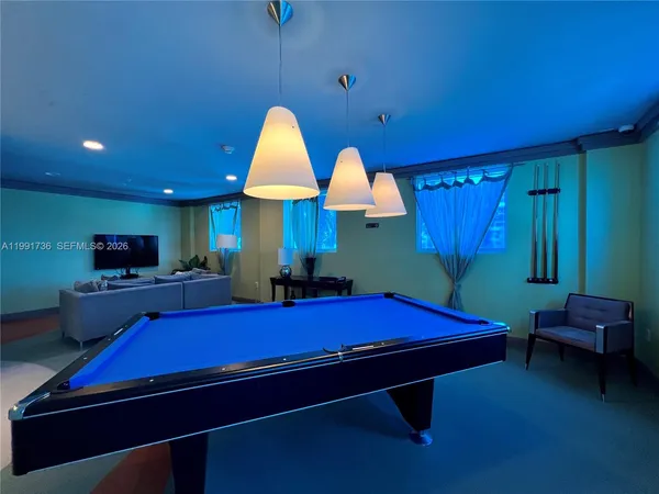 a view of swimming pool with outdoor seating