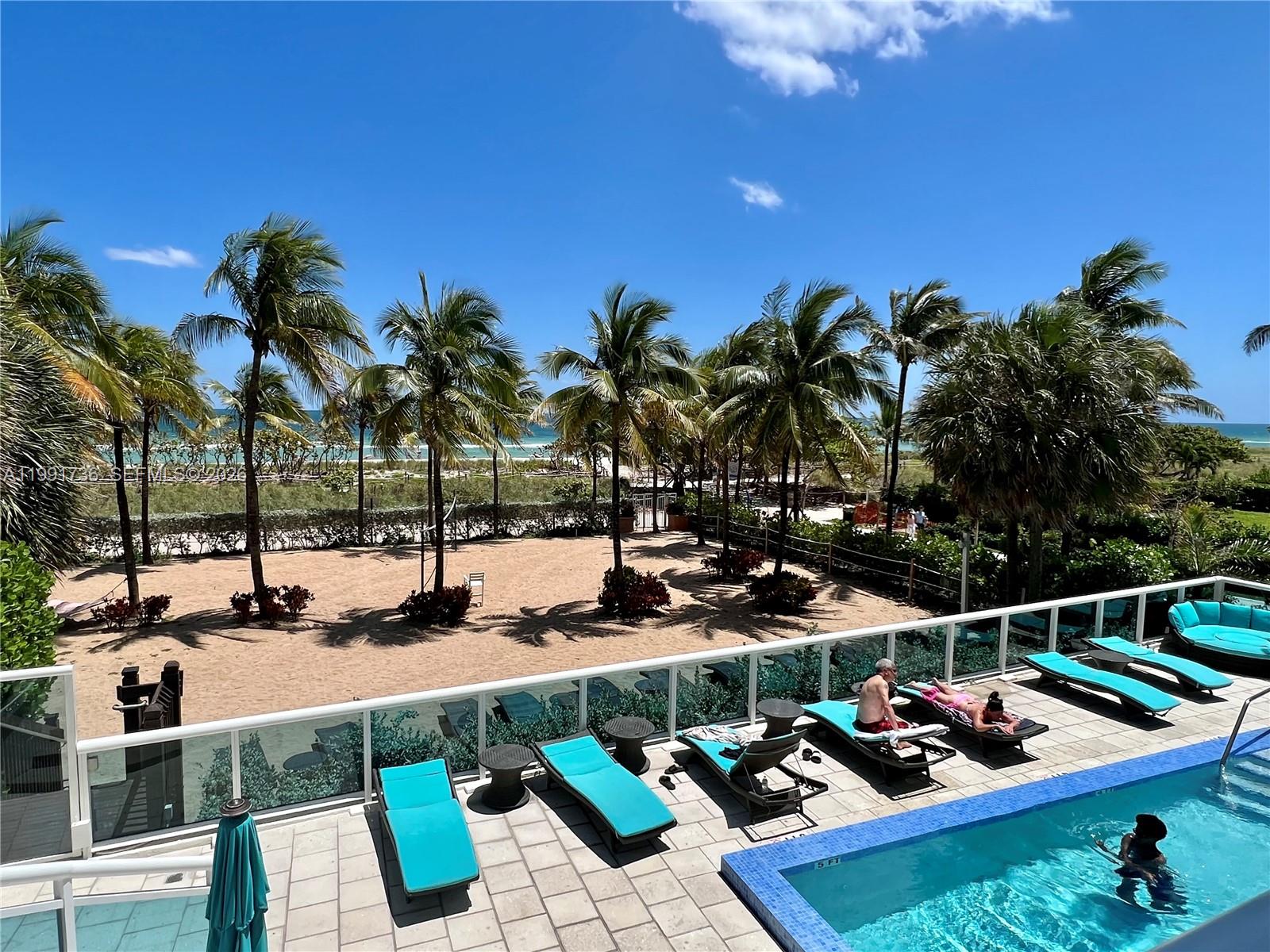 9172 Collins Avenue, Unit 214 Surfside, FL 33154 - Photo 25 of 33 a view of swimming pool with outdoor seating