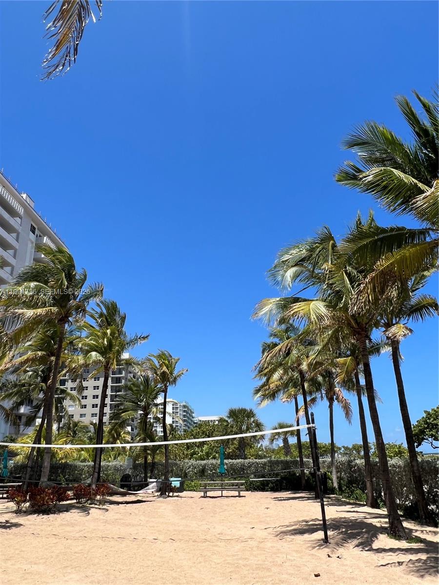 9172 Collins Avenue, Unit 214 Surfside, FL 33154 - Photo 31 of 33 a view of a yard with a house