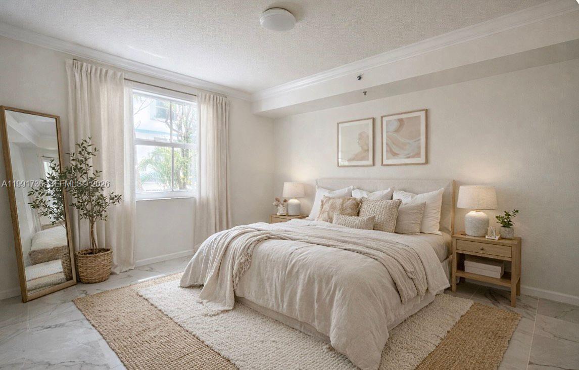 9172 Collins Avenue, Unit 214 Surfside, FL 33154 - Photo 4 of 33 a bedroom with a large bed and a window