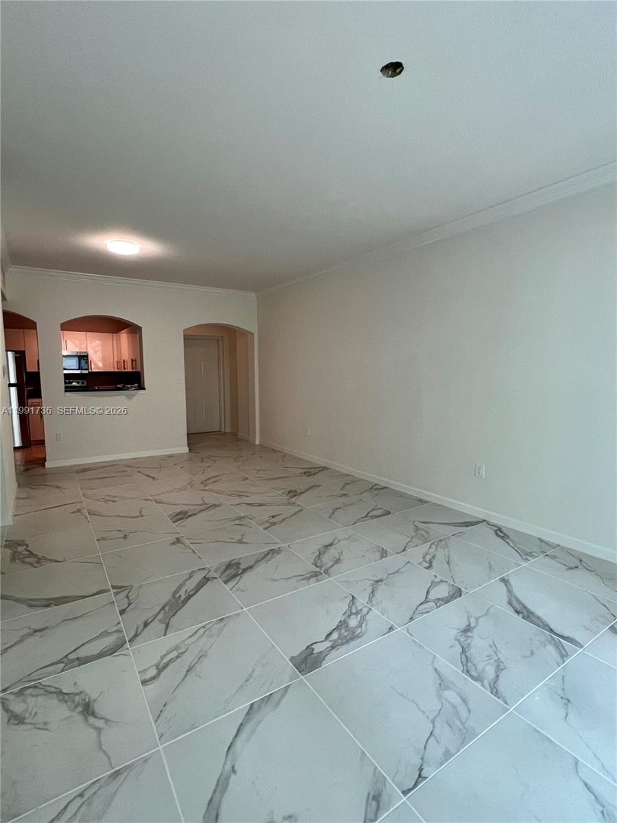 9172 Collins Avenue, Unit 214 Surfside, FL 33154 - Photo 7 of 33 a view of a hallway