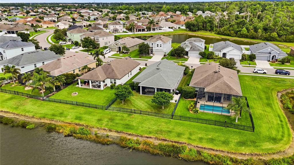 10920 79th Street East Parrish, FL 34219 - Photo 67 of 73 an aerial view of residential houses with outdoor space and parking