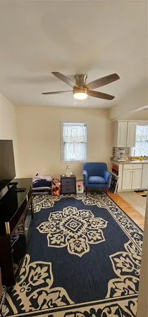 a living room with a couch and a window