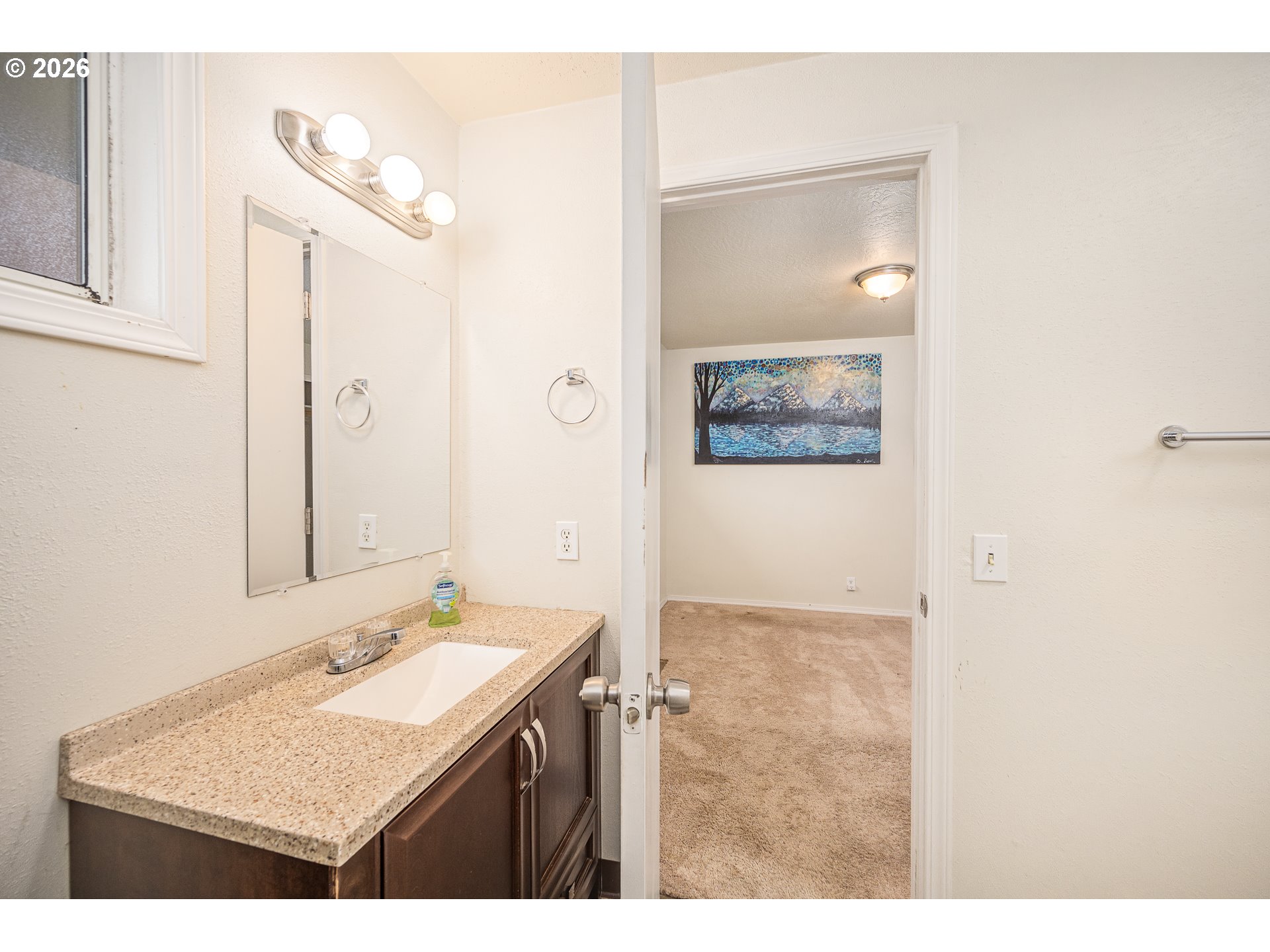 425 Autumn Avenue Eugene, OR 97404 - Photo 16 of 40 a bathroom with a sink vanity and a mirror