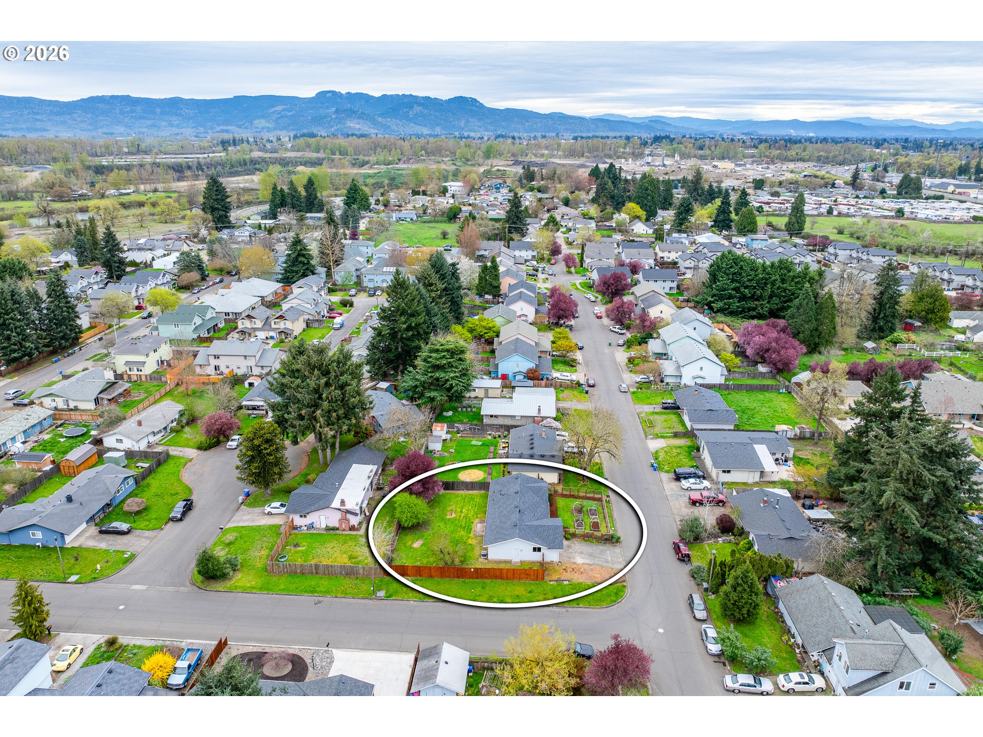 425 Autumn Avenue Eugene, OR 97404 - Photo 27 of 40 a view of a city with lots of residential buildings and mountain view in back