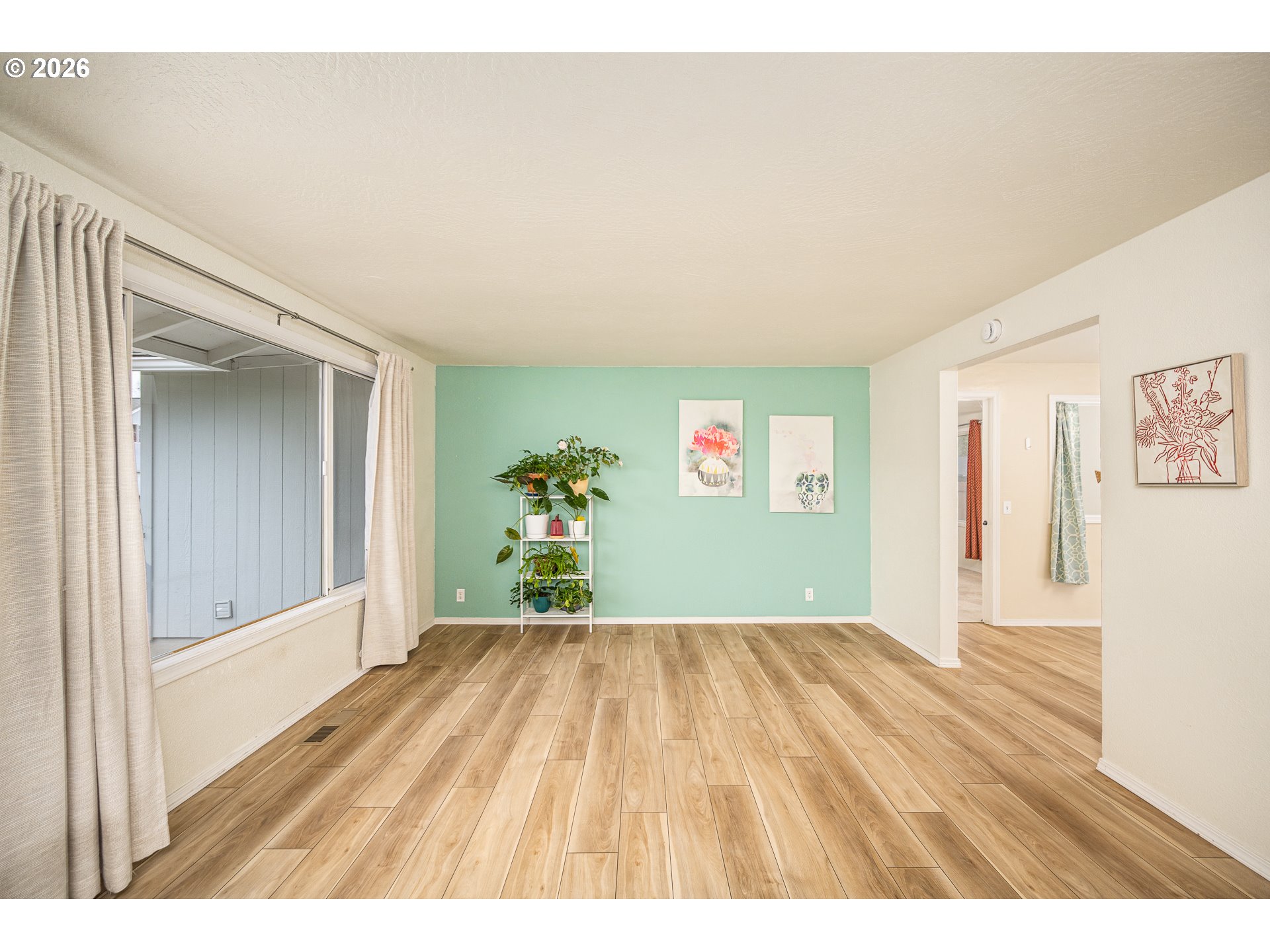 425 Autumn Avenue Eugene, OR 97404 - Photo 3 of 40 a view of an empty room with a window
