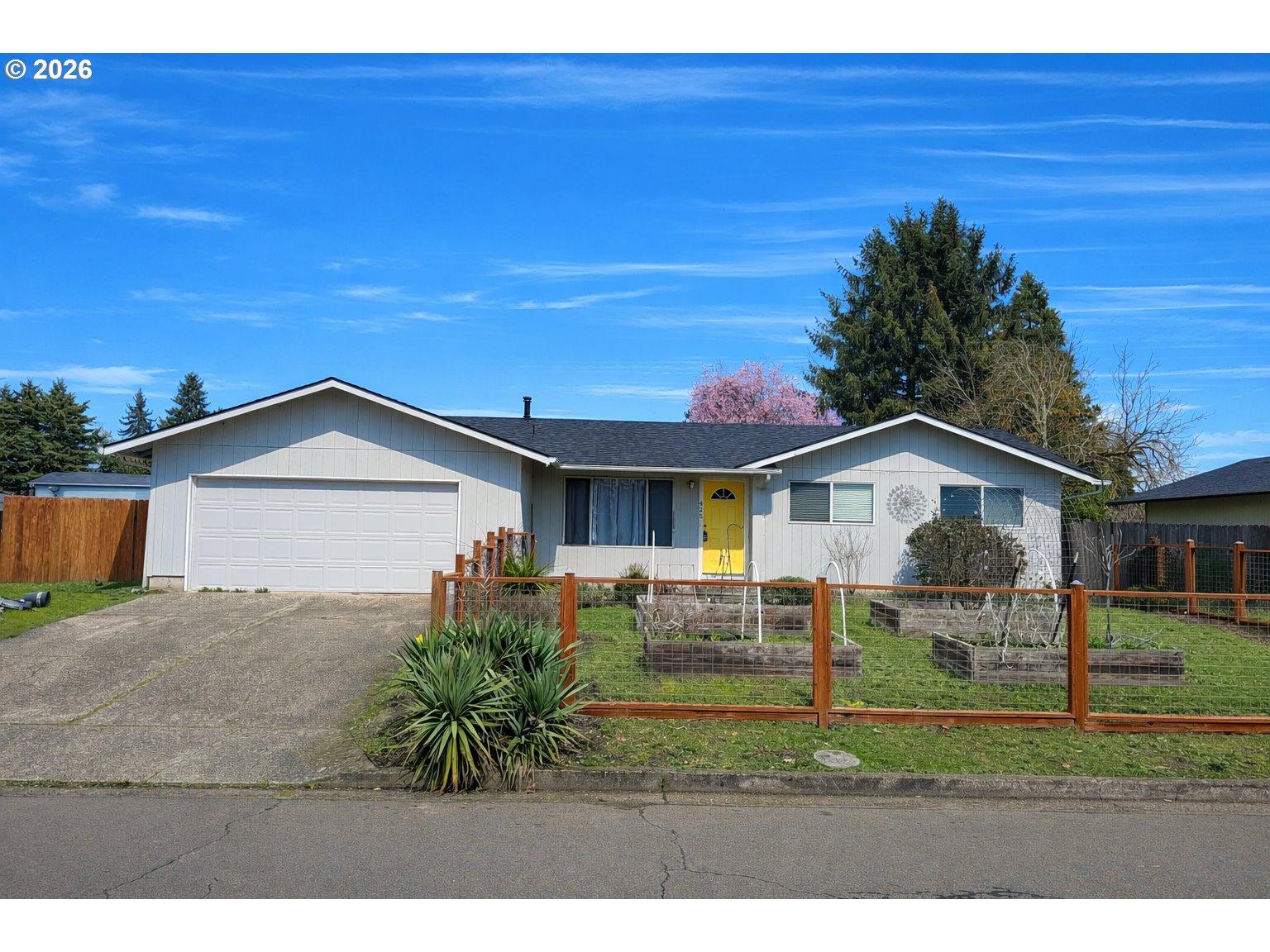 425 Autumn Avenue Eugene, OR 97404 - Photo 35 of 40 a front view of a house with a yard and garage