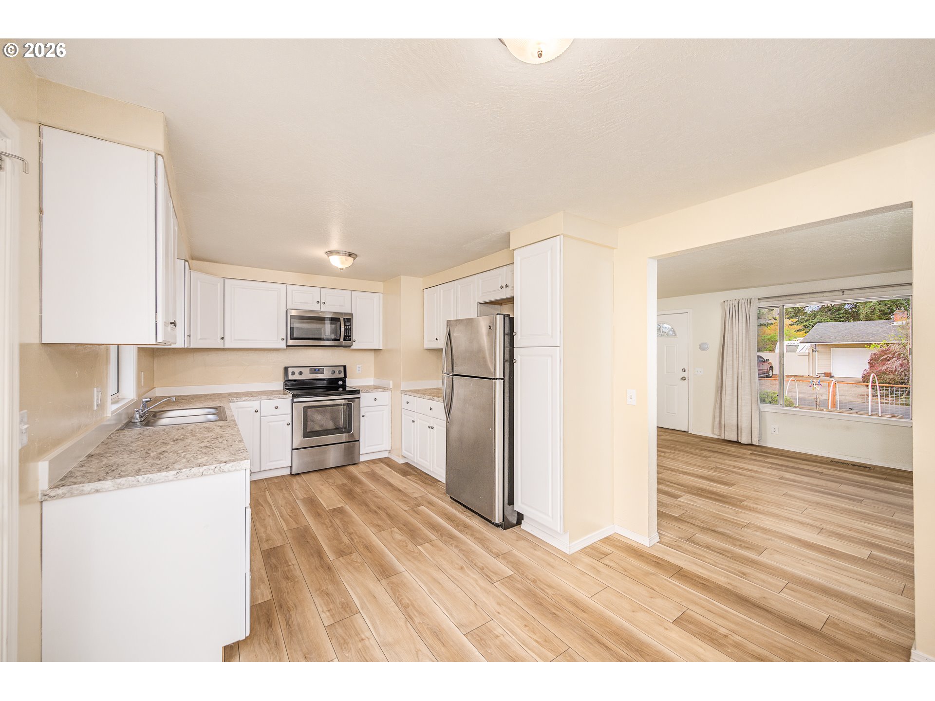 425 Autumn Avenue Eugene, OR 97404 - Photo 9 of 40 a kitchen with a refrigerator sink and cabinets