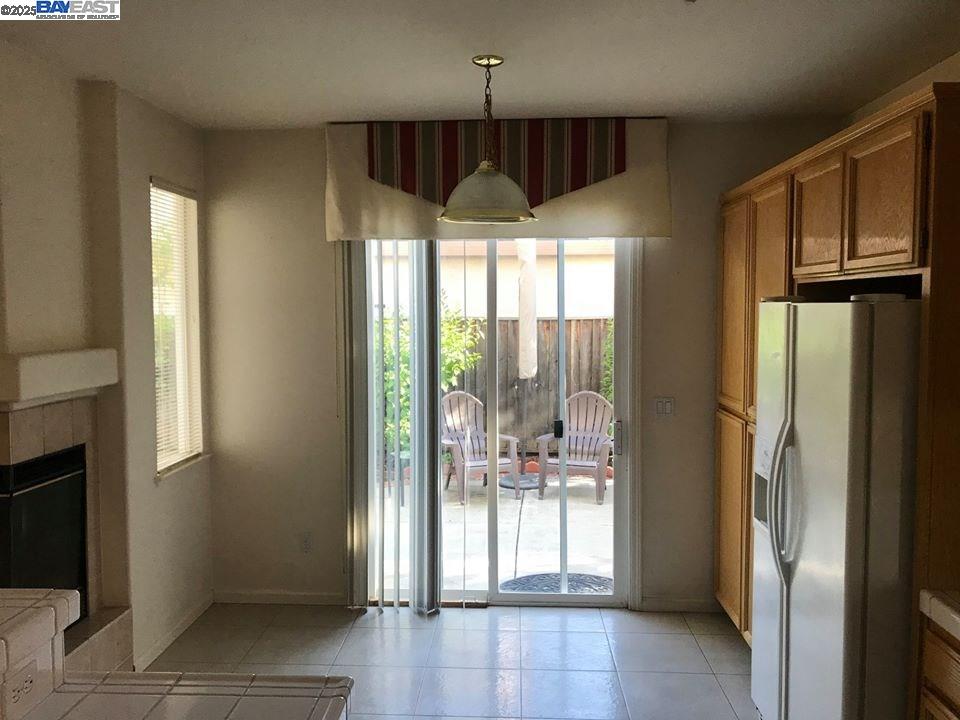2173 Leafcrest Common Livermore, CA 94551 - Photo 12 of 25 a very nice looking room with a large window and chandelier