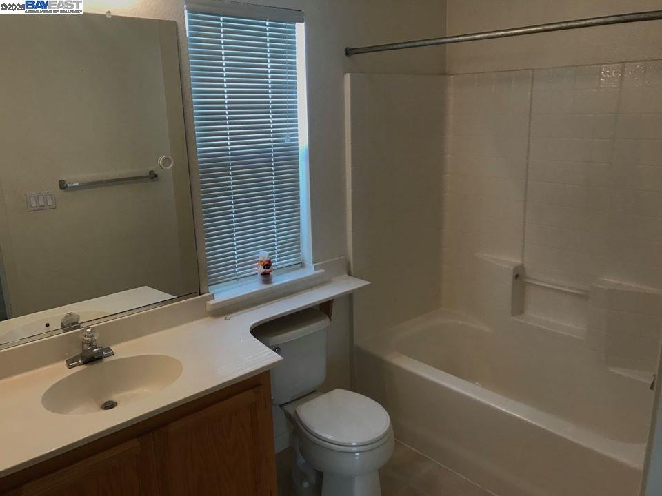 2173 Leafcrest Common Livermore, CA 94551 - Photo 18 of 25 a bathroom with a sink toilet and shower