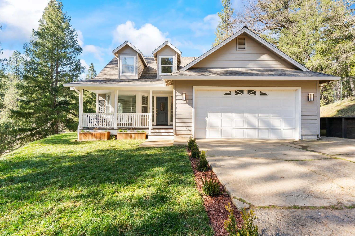 a front view of a house with yard