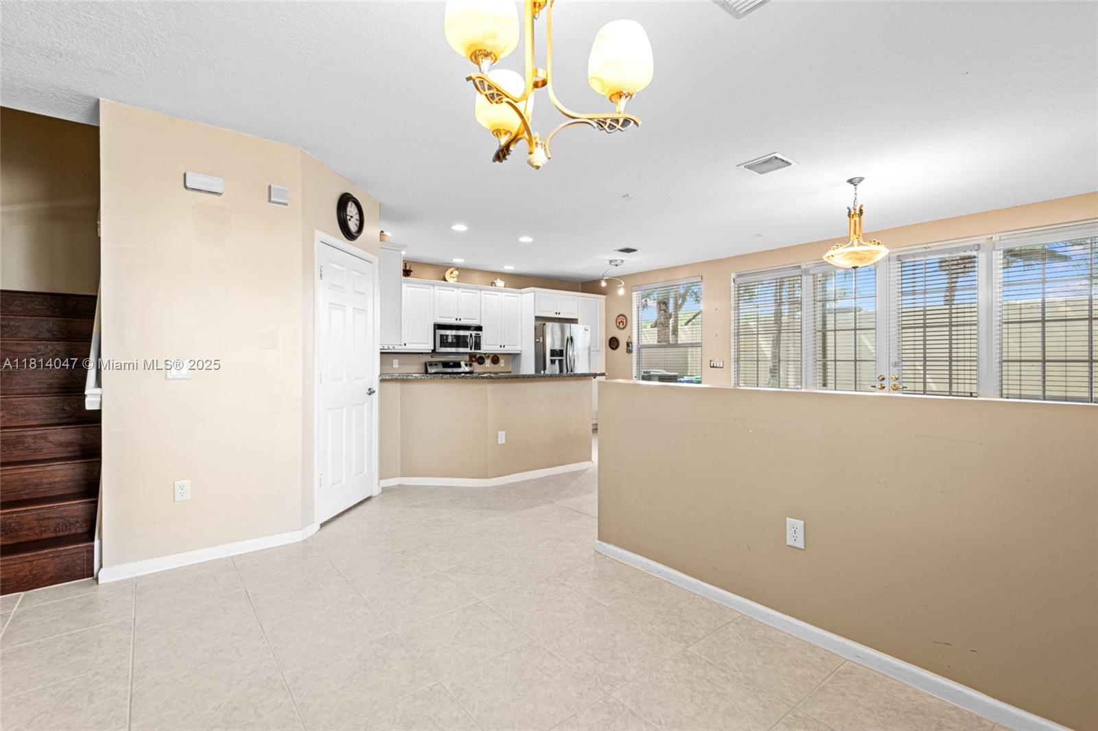 16316 Southwest 48th Street Miramar, FL 33027 - Photo 19 of 37 a view of a kitchen with furniture and a counter top space