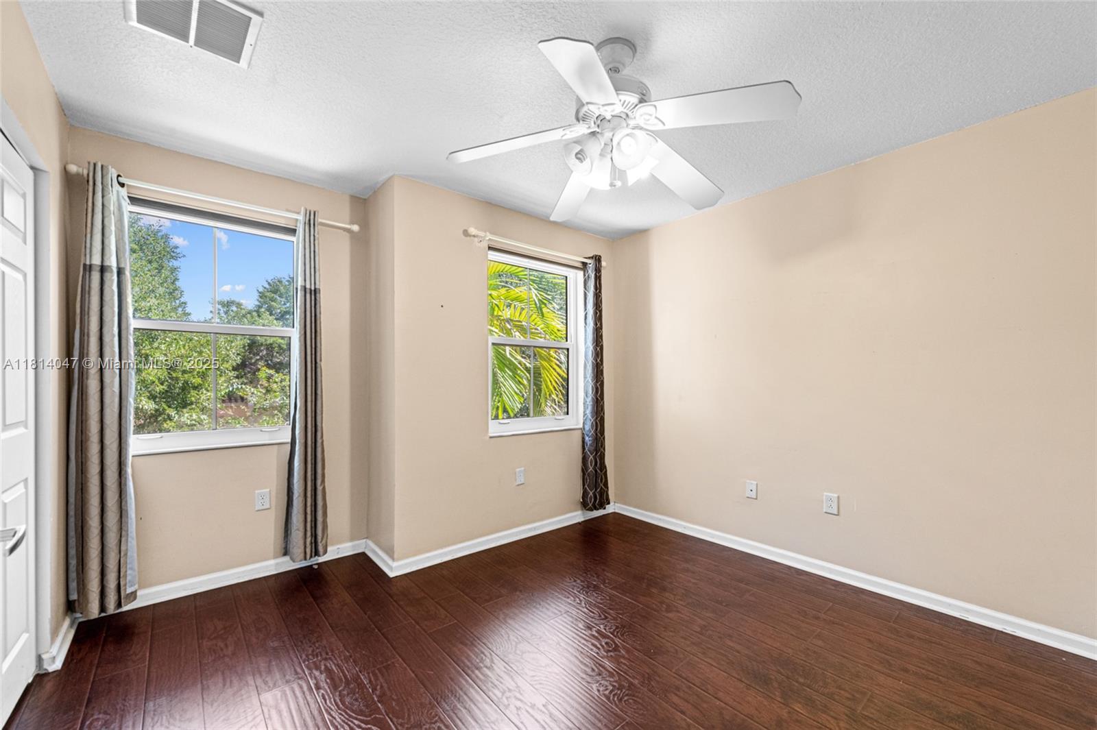 16316 Southwest 48th Street Miramar, FL 33027 - Photo 24 of 37 wooden floor in an empty room with a window