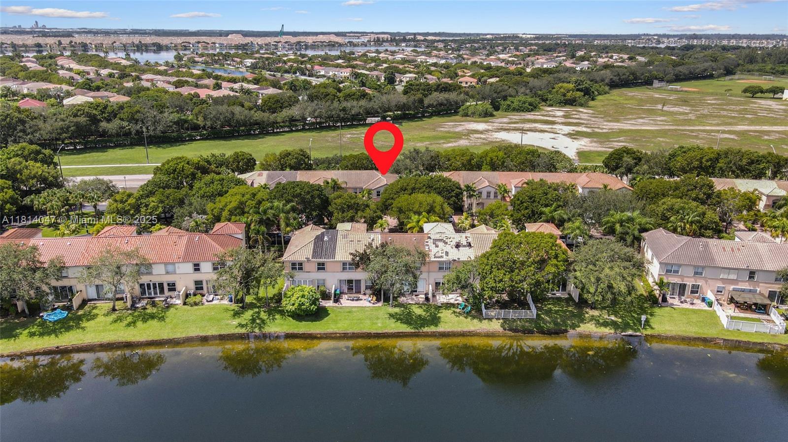16316 Southwest 48th Street Miramar, FL 33027 - Photo 34 of 37 an aerial view of residential houses with outdoor space and lake view